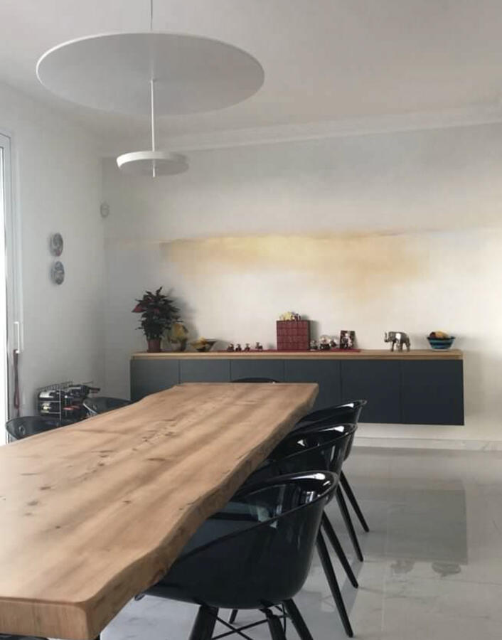 Bright contemporary apartment in Sliema, Malta, showcasing a bespoke Lebanese cedar table, natural materials, and sea-facing interiors — designed by Alveum.